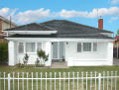 LARGE DOUBLE FRONTED WEATHERBOARD HOME WITH AN ART DECO APPEAL. Picture