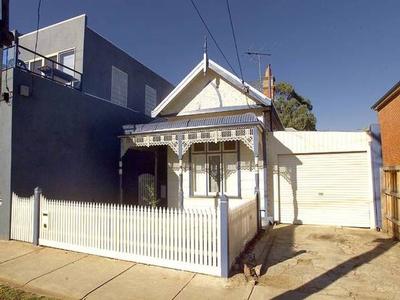 Single fronted Victorian with block facade. Picture