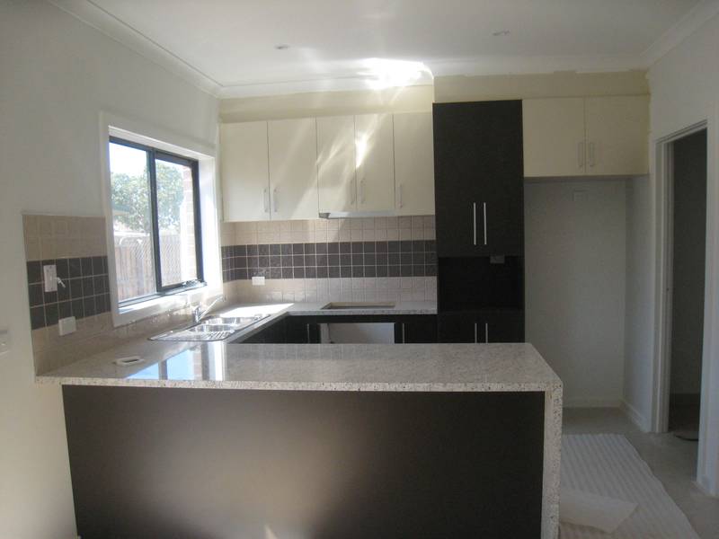 New, Spacious & Central! Picture 2