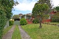Brick Home with Level Grass Yard in Quiet Street Picture