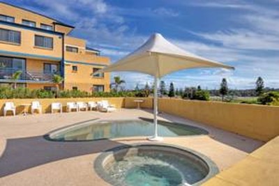 2 BR UNIT ACROSS THE ROAD FROM THE PRETTIEST SURF BEACH Picture