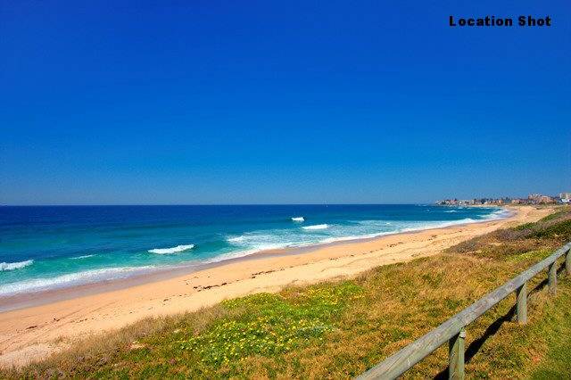 2 BR UNIT ACROSS THE ROAD FROM THE PRETTIEST SURF BEACH Picture 2