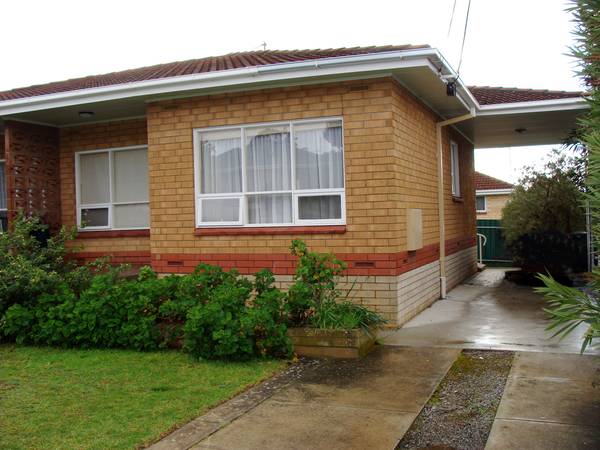 Solid Brick Unit with Tiled Roof & Carport Picture