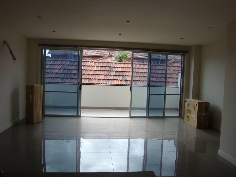 This three level townhouse is set back from the street, private and secure. Picture