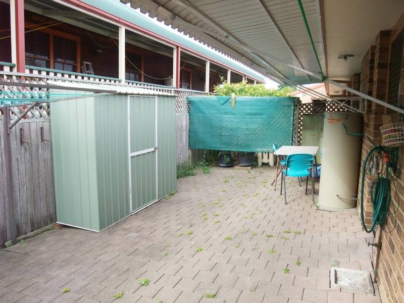 Roomy Palm Court Unit complete with garage Picture 2