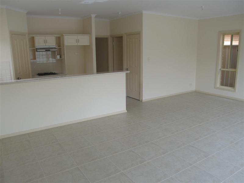 AFFORDABLE ~ Brand New Courtyard Home Picture 3