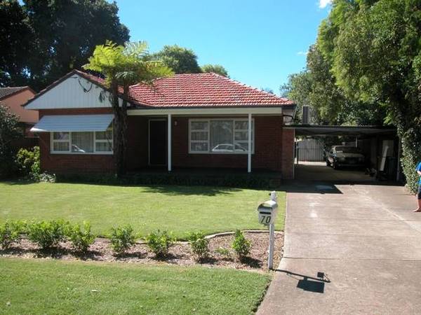 Immaculately presented 3 bedroom home with enclosed 4 car carport! Picture
