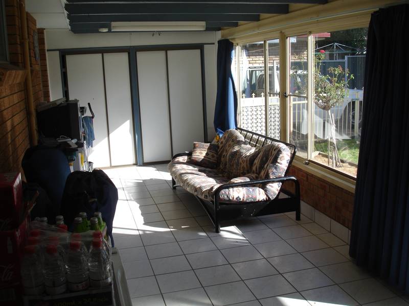 BRICK HOME, EXTRA LIVING SPACES, LOTS AND LOTS OF SHEDDING FOR DAD Picture 2