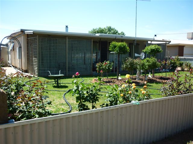 Tidy Home & Bungalow Package in a Neat Yard Picture 1