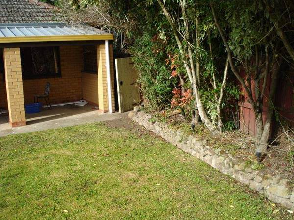 Classic Triple Fronted Cream Brick Home Picture