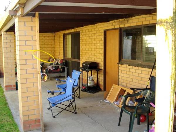 Classic Triple Fronted Cream Brick Home Picture