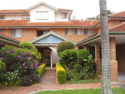 LUSH GREENERY SURROUND THIS BEAUTY THAT AFFORDS VIEWS OF THE SOUTHPORT GOLF COURSE.. Picture