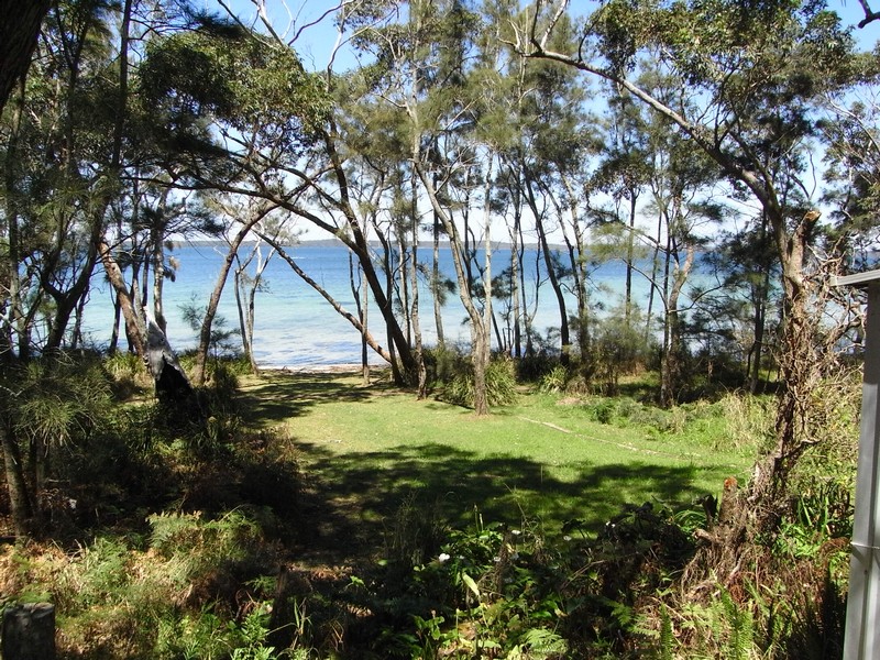 Lush Waterfront Reserve Living Picture 1